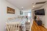 Dining area featuring attic access, light wood-style flooring, and recessed lighting
