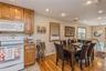 Dining space with light wood-type flooring, recessed lighting, and a chandelier