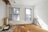 Empty room with radiator and hardwood / wood-style flooring