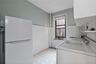 Laundry room with light floors