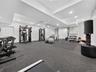Exercise room with recessed lighting and baseboards