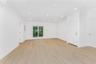 Empty room featuring light wood finished floors, recessed lighting, and electric panel