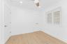 Unfurnished bedroom featuring light wood-style flooring, recessed lighting, a ceiling fan, and a closet