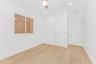 Empty room with light wood finished floors, ceiling fan, recessed lighting, and a smoke detector