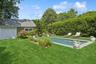 Pool house and garage and pool.