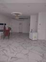 Spare room featuring light marble finish flooring