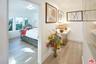 Hallway leading to staged bedr