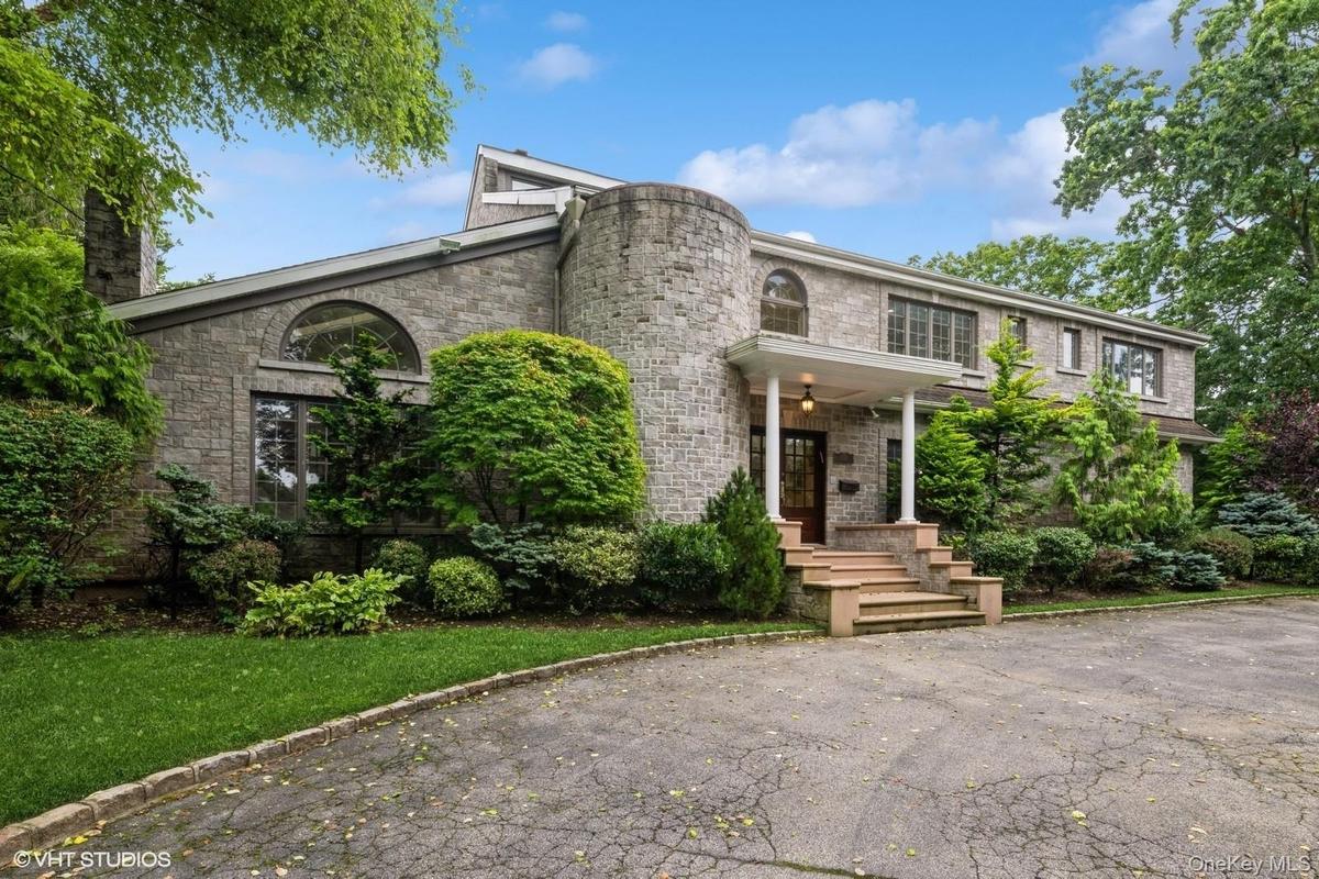 Front of property featuring a chimney