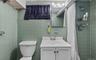 Full bathroom with vanity, tile walls, and a tile shower