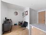 Living area with baseboards and recessed lighting
