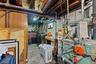 Below grade area with washer / dryer, gas water heater, and a heating unit