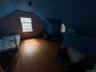 Bonus room with wood finished floors and vaulted ceiling
