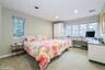 Bedroom with light carpet, an office area, and recessed lighting