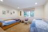Bedroom featuring carpet floors, recessed lighting, and a baseboard radiator