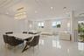 Dining area featuring a decorative wall, a chandelier, recessed lighting, and light marble finish flooring
