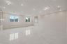 Empty room featuring radiator, light marble finish floors, and recessed lighting