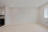 Spare room featuring recessed lighting and radiator heating unit