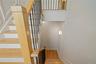 Stairway featuring wood finished floors and baseboards
