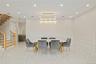 Dining area featuring a decorative wall, recessed lighting, stairs, and light marble finish floors