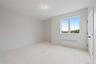 Empty room with radiator and light wood-style flooring