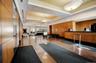 Common area featuring recessed lighting and wood walls