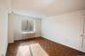Spare room with radiator heating unit and baseboards