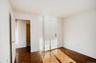 Unfurnished bedroom featuring a closet and baseboards