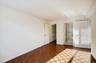 Unfurnished bedroom featuring ensuite bath and a walk in closet