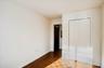 Unfurnished bedroom featuring baseboards and a closet