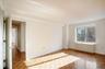 Spare room with radiator heating unit and a textured ceiling