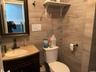 Half bath featuring toilet and vanity