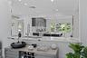 Kitchen featuring gray cabinetry, recessed lighting, pendant lighting, and glass insert cabinets
