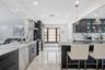 Kitchen with island range hood, dishwasher, electric range, light marble finish floors, and recessed lighting