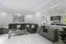 Living area with recessed lighting, light marble finish floors, and a tray ceiling