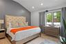 Bedroom featuring vaulted ceiling, light wood-type flooring, and recessed lighting