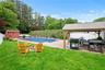 Fenced backyard featuring a gazebo, an outdoor fire pit, a patio area, and a shed