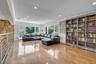 Upper Level Den Overlooking Living room featuring crown molding, plenty of natural light, wood flooring, and recessed lighting