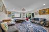 main Floor Primary Bedroom featuring ornamental molding, recessed lighting, and access to exterior