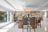 Dining Room with a raised ceiling, plenty of natural light, and ornamental molding