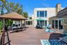 Trex terrace with a gazebo, outdoor dining space, and area for grilling