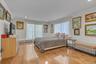 Bedroom with recessed lighting, light wood floors, and ornamental molding