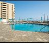 Community pool featuring a patio