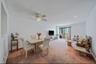 Carpeted dining space featuring recessed lighting and ceiling fan