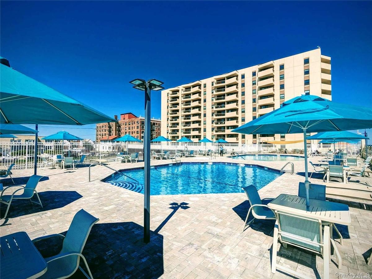 Community pool with a patio