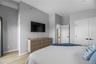 Bedroom with light wood-style floors and recessed lighting
