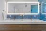 Full bath featuring tasteful backsplash and double vanity