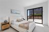 Bedroom with baseboards and access to outside