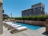 View of swimming pool featuring a deck