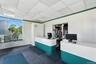 Reception area featuring pet washing station and a paneled ceiling