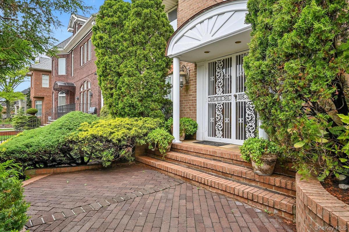 Entrance to property featuring brick siding